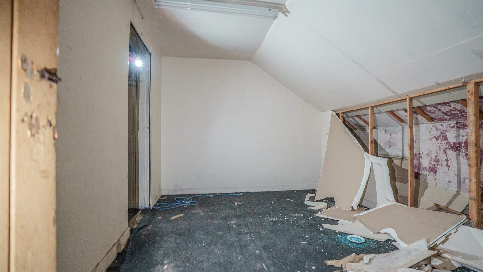 The same building stripped back to studs and plasterboard mid-refurbishment